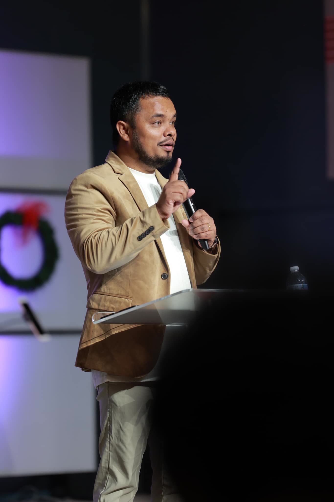 Pastor Binay Bhandari preaching on a Sunday morning